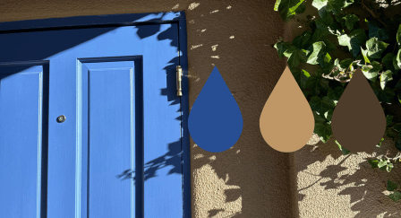 periwinkle front door on an adobe home